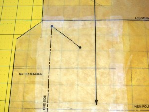 It's a little difficult to see the the tape, but I shortened the length of the skirt at the lengthen/shorten line and adjusted the placement of the slit extension.