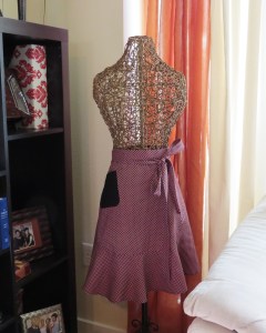 Red and Black stretch cotton print with solid black stretch cotton pocket.