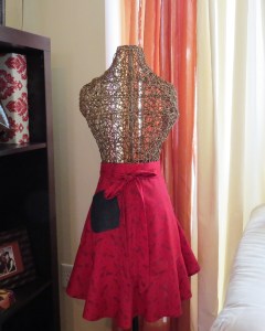 Rec cotton with navy blue floral print.  Denim pocket.